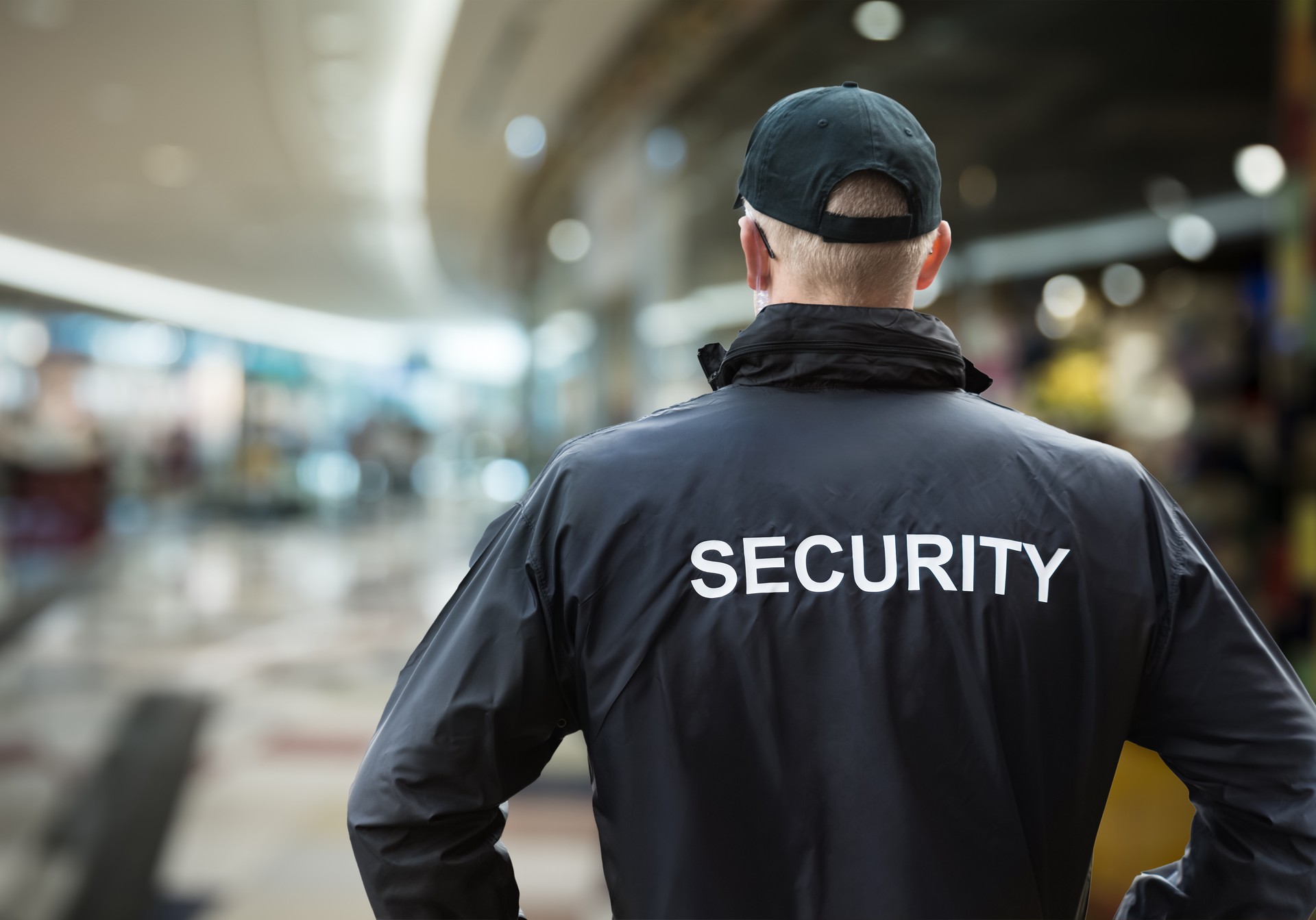 Security Man Looking At Moscow Kremlin And St Basil's Cathedral